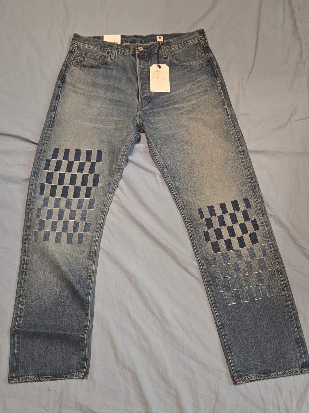 Men's Blue Washed Denim Jeans with Checker Patch Details